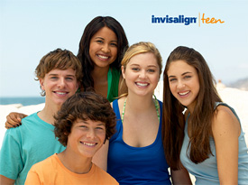 Invisalign Teen image with 5 teens wearing Invisalign posing together at the beach