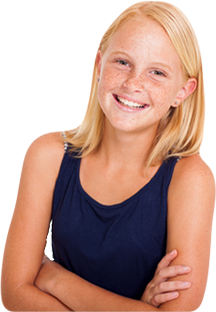 Child smiling for a picture with arms crossed in front of her dark navy tank top