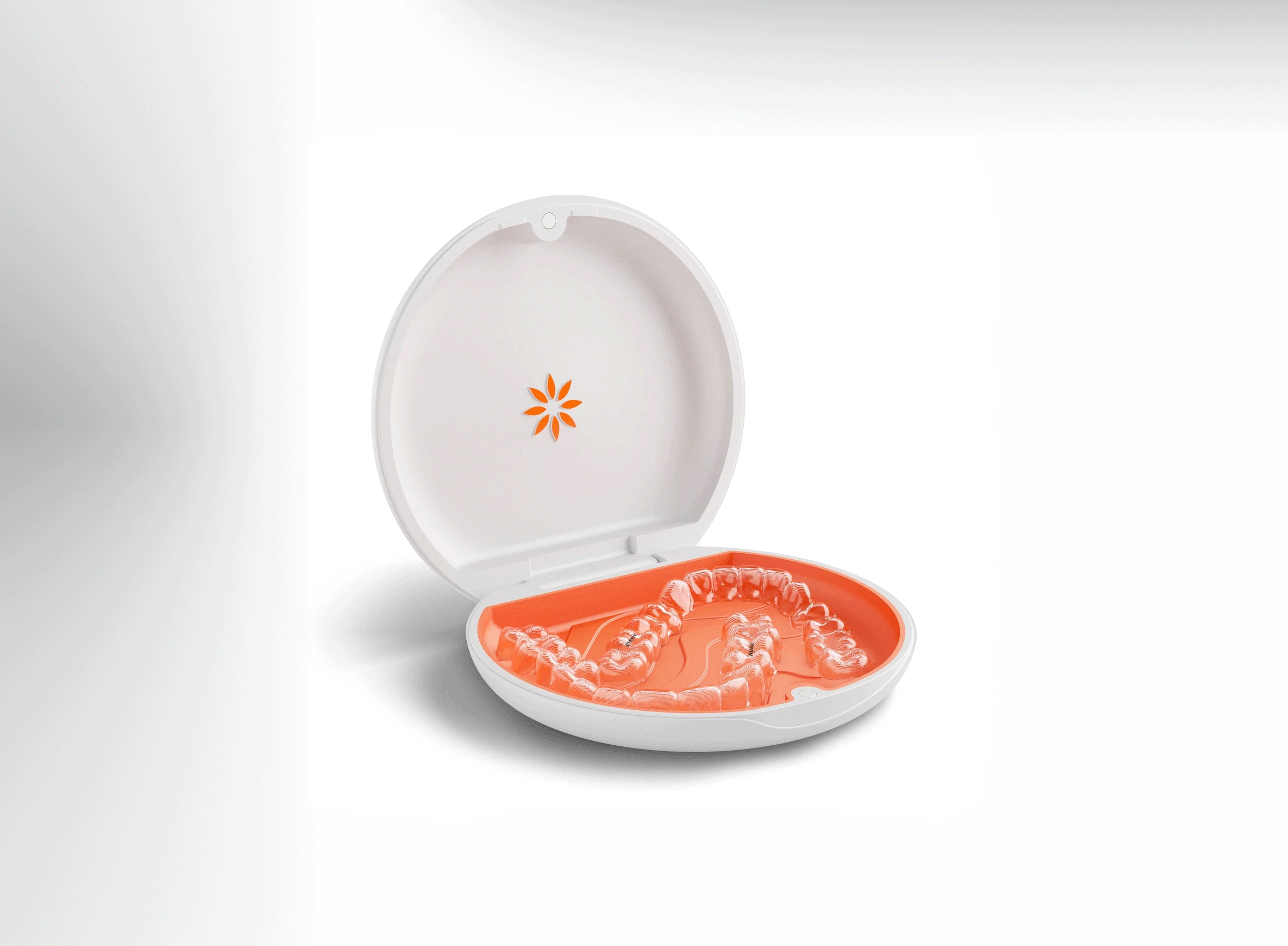 Vivera Retainers in an open white and orange plastic case.